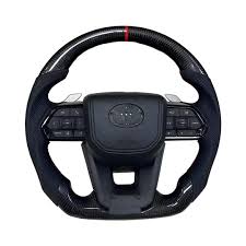 Toyota LC300 Real carbon steering with paddles.