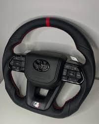 Toyota LC300 Real carbon steering with paddles.